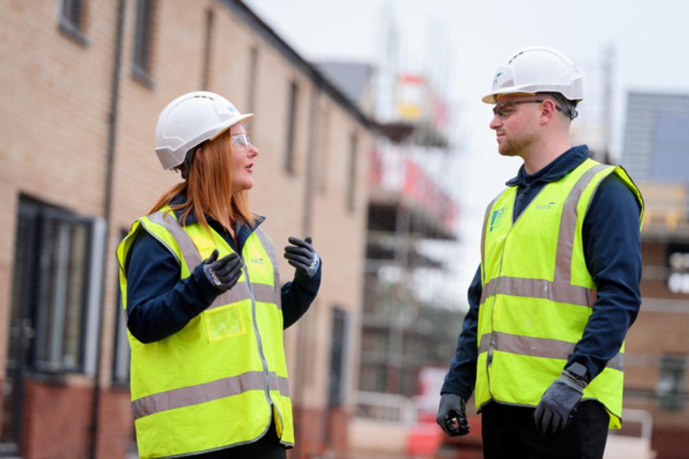 Wates employee discussing something